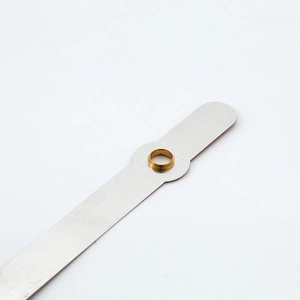 Silver quartz clock hands with golden copper axle sleeve and brushed metal texture