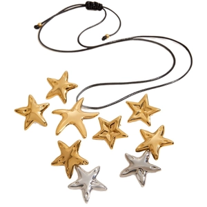 Minimalist stainless steel necklace with gold and silver stars on a black cord