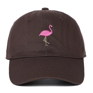Close-up of pink flamingo embroidery on dark brown cotton baseball cap detail