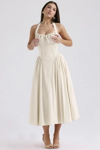 Detail view of almond beige halter neck dress with corset waist and linen texture