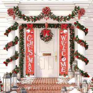 Red Christmas porch banners with Santa and Snowman hanging on a festive white front door