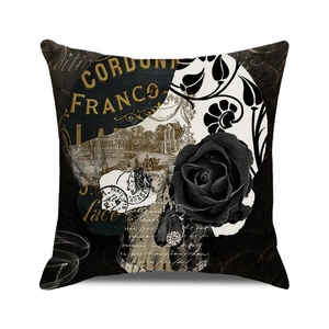 Detailed skull and rose collage on vintage textured fabric cushion cover for Halloween