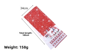 Detail view of a Christmas table runner with dimensions 34cm by 180cm in festive red and white