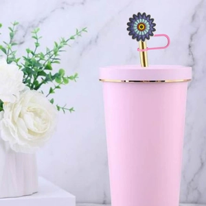 Blue sunflower silicone straw cover for Stanley cups on metal straw with pink clip