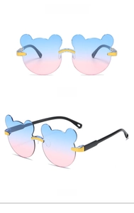 Close-up of blue-pink gradient bear-shaped frameless sunglasses for kids with gold details