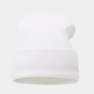 Close-up of white knit beanie showing detailed vertical ribbed texture and elastic material