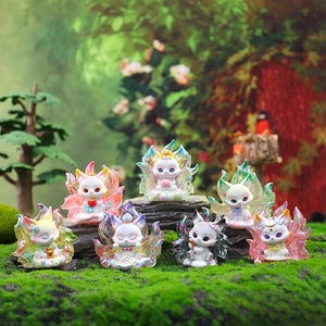 Group of colorful glowing Kitsune fox figurines displayed on mossy forest landscape