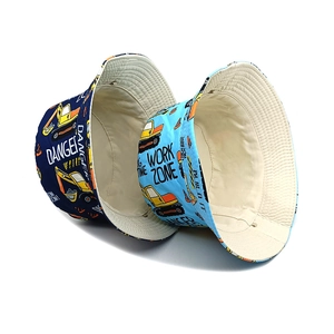 Kids reversible bucket hats featuring cartoon excavator prints in navy and light blue