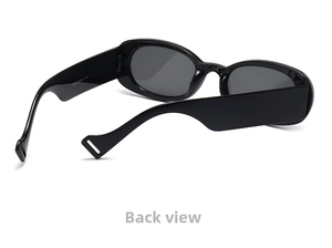 Detail view of oval sunglasses featuring wide black temples and inner technical markings