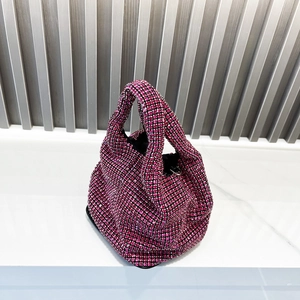 Detail shot of a high-density fuchsia rhinestone hobo bag with sparkling crystal stones