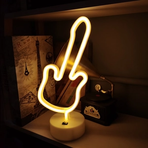 Guitar-shaped warm yellow LED neon sign on a white base for cozy desktop atmosphere