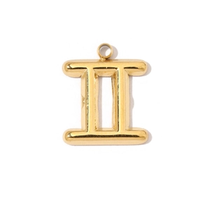 Macro detail of 18K gold titanium steel Gemini constellation Roman numeral pendant