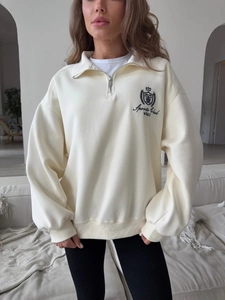 Cream oversized half-zip sweatshirt with vintage sports club embroidery and dropped shoulders