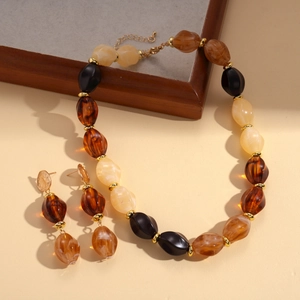 Retro acrylic oval beaded necklace and earrings set with amber and black resin beads
