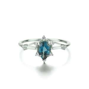 Elegant S925 sterling silver ring with pear-cut blue gemstone and zircon accents