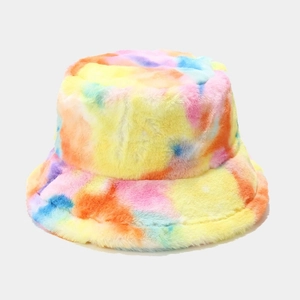 Close-up of soft faux fur bucket hat with vibrant colorful tie-dye patterns and plush texture
