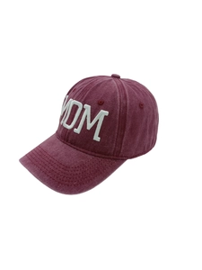 Close-up of white 3D MOM embroidery on washed cotton burgundy baseball cap