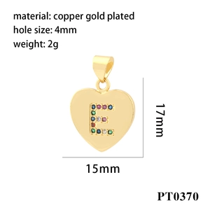 Detail of 18K gold plated copper heart pendant with letter E in colorful zircon stones