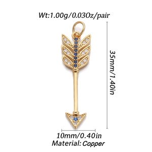 Detailed size view of gold arrow pendant with blue zircon stones and copper material