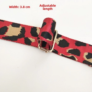 Detail of red leopard print bag strap with 3.8cm width and adjustable gold metal buckle