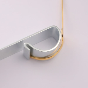 Detailed macro view of gold and silver stainless steel jewelry metal bending components