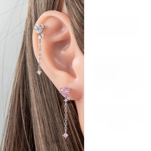 Detail shot of heart-shaped crystal tassel earrings with titanium steel screw back studs