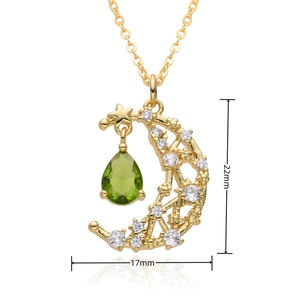 Detailed view of gold necklace pendant showing 22mm by 17mm moon and star dimensions