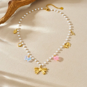 Beaded pearl necklace featuring acrylic gradient butterflies and golden bow pendants