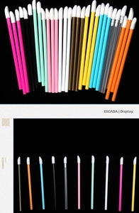 Detail of disposable flocking lip brushes in multiple colors with soft white brush heads