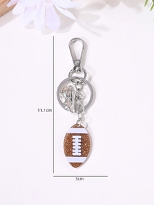 Detail view of American football keychain with 11.1cm length and glitter pendant detail