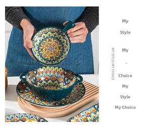 Detailed view of hand-painted Bohemian ceramic plates and bowls with mandala patterns