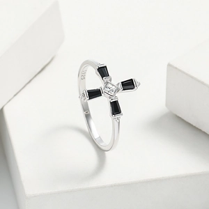 Close-up of S925 sterling silver cross ring featuring black gems and white zircon details