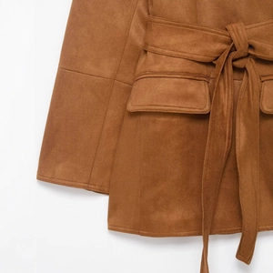 Brown faux suede jacket featuring a waist belt and functional flap pockets in a long cut