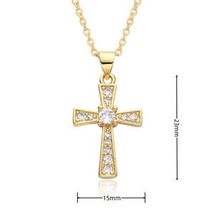 Macro detail of gold cross pendant with clear cubic zirconia stones and 23mm height scale
