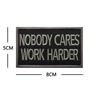 Nobody Cares Work Harder tactical embroidery patch in black and white 8x5cm