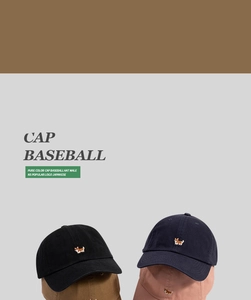 Detail view of baseball caps in various colors with cute Corgi embroidery on the front