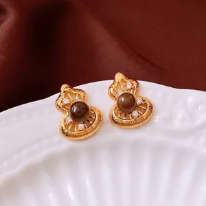 Vintage gold hollow gourd earrings with brown tiger eye stone and zircon crystals