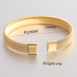 Detail of 6mm gold braided stainless steel open bangle with 62mm inner diameter