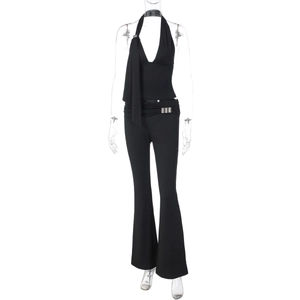 Detail view of black halter neck top and high-waisted flared pants two-piece set