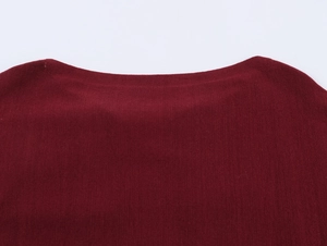 Detail of the elegant boat neck design on a burgundy fine-knit floral sweater for women