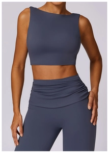 Detail view of high-waist yoga leggings with scrunch waist design in deep grey-blue fabric