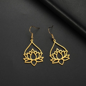 Elegant gold-plated hollow lotus drop earrings displayed on a black leather texture