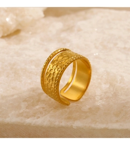 Detailed macro shot of the hammered texture on this wide double-band gold open ring