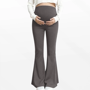 Macro view of high-waist abdominal support design on dark grey maternity yoga flare pants