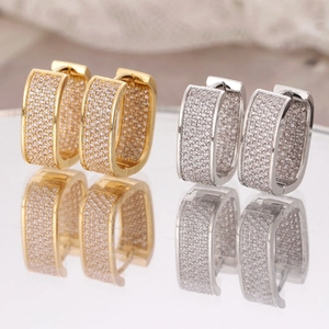 Luxurious gold and silver U-shaped hoop earrings with micro-pave cubic zirconia stones