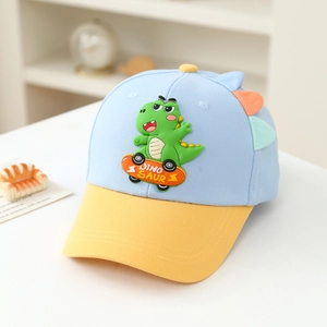 Detail of cartoon dinosaur on a blue child baseball cap with 3D fins and yellow brim