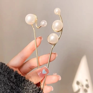 Elegant gold pearl hair pins with minimalist curved and straight designs for women