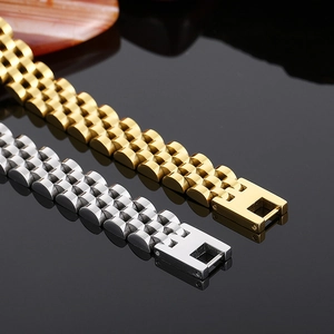 Macro detail of high-polish stainless steel watch bands in gold and silver finishes