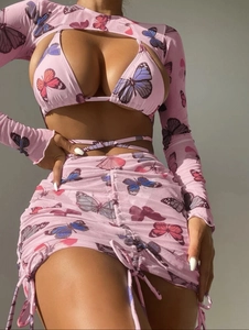 Close-up of pink butterfly print mesh fabric with drawstring ruched skirt details