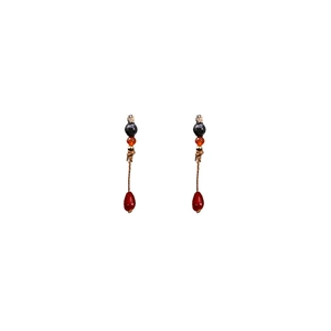 Detail showing vintage Chinese style beaded earrings with red water drop pendants